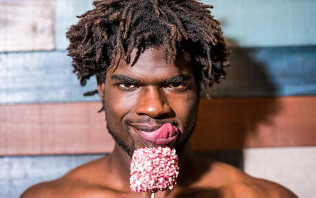 Ebony beefy Devin Trez shows a muscle body