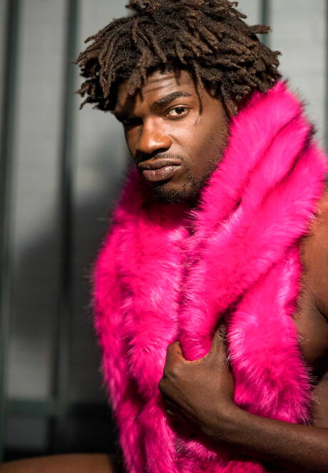 Ebony beefy Devin Trez shows a muscle body