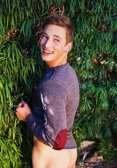 American twink Casey Tanner posing naked and showing tight ass outside