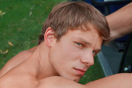 Muscular Clark Eckhart posing naked and showing tight butt outside