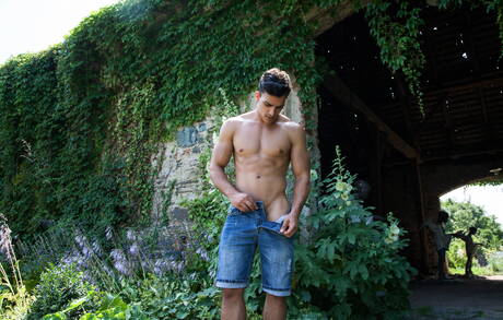 Latin husky guy Miguel Estevez posing naked and showing his ass outdoor