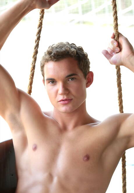 Strongman Damian Ross shows a well-build body outdoor