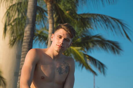 Hot american boys stud Levi Karter and husky guy Troy Accola in hot anal sex on beach