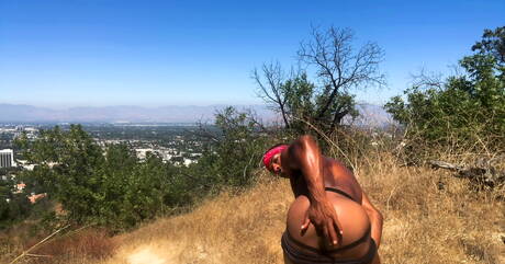 Black tough guy Adrian Hart jerking with toy outdoor