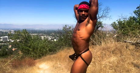 Black tough guy Adrian Hart jerking with toy outdoor