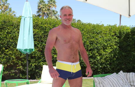 American mature bear Dale Savage undressing and showing nice butt outside