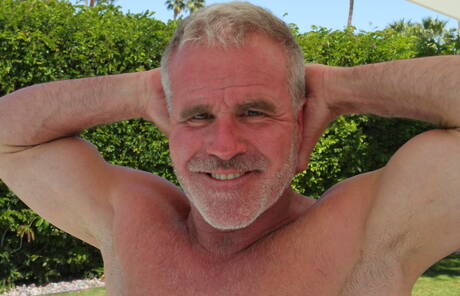 American mature bear Dale Savage undressing and showing nice butt outside