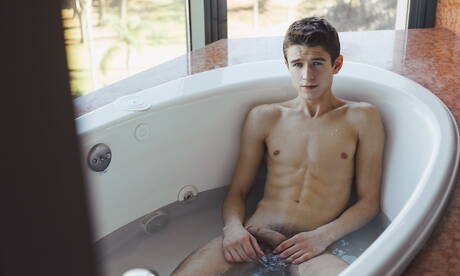 American twink Evan Parker teasing his cock in bath
