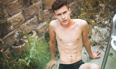 American young dude Nate Morgan undressing and showing hot butt outside