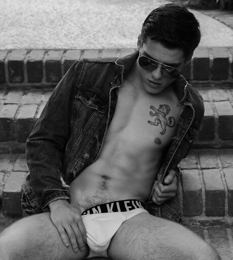 American hunk Blake Mitchell undressing and showing his butt at the pool