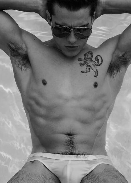 American hunk Blake Mitchell undressing and showing his butt at the pool