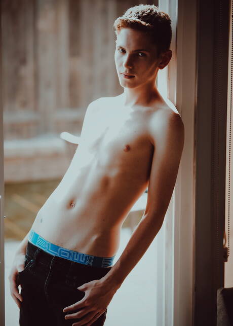 American young Riley Finch undressing and showing tight ass outdoor