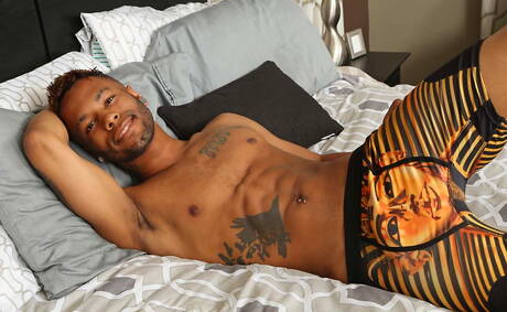 Black muscular Pharaoh Beckham shows a sturdy body