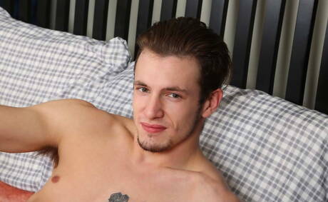 Muscular Tyler Graves posing naked and showing his ass