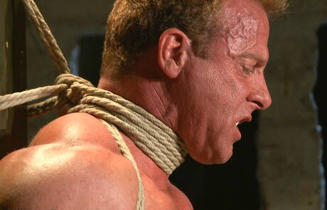 Strongman Derek Pain in bondage sex scene