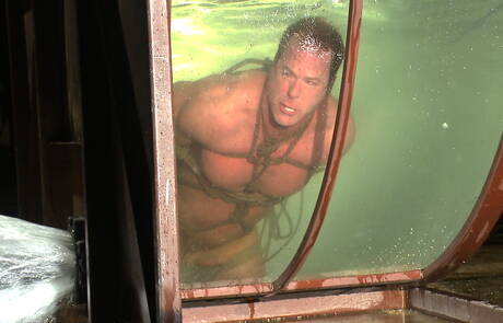 Strongman Derek Pain in bondage sex scene