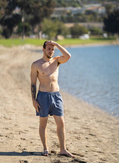 Husky guy Rowan and american stud Brysen posing naked and showing butt on the beach