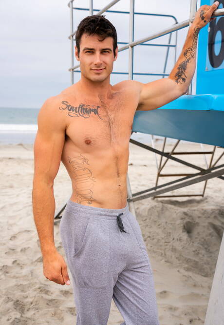 Strongman Blake and american beefcake Jeb have anal sex on beach