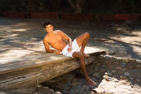 American hunky guy Eddie Danger posing naked and showing tight butt outside