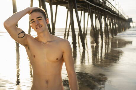 Superstud Will shows a perfect body on beach