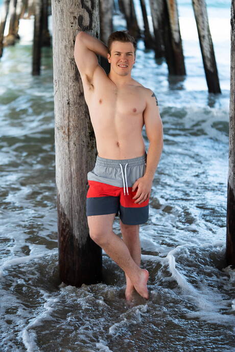 Muscular Robbie and strongman Clyde in hot homosexual action on the beach