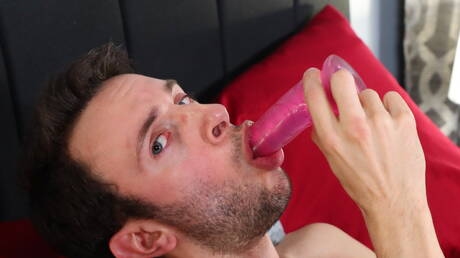 American twink Izzy Danger teasing with sex toy