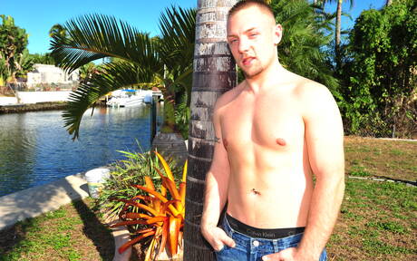 Black husky guy Izzy James and strongman Cole Mckenzie in black on white love on the beach