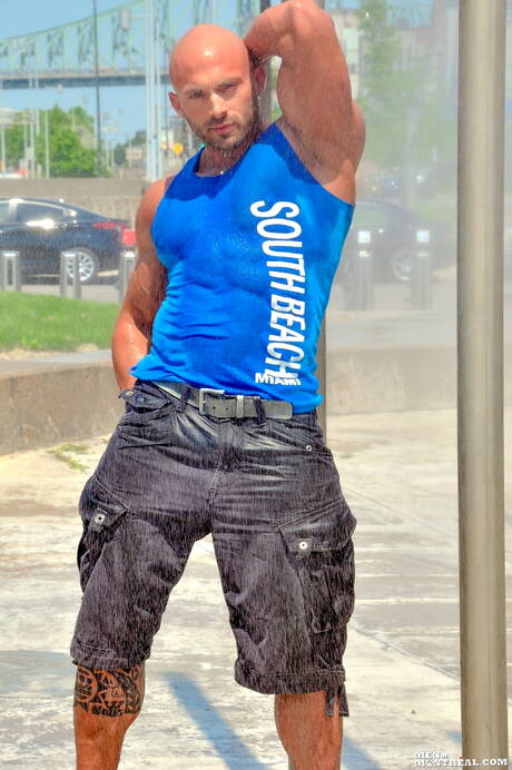 Strong bull Max Chevalier shows a muscle body in hot shower