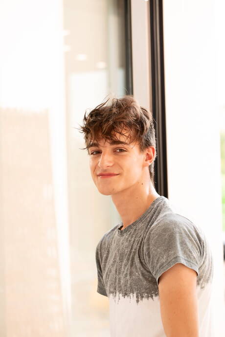 Hot twink Miles Murray undressing and showing tight butt