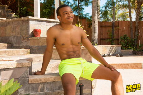 Black hunky guy Ace undressing and showing tight ass in the pool