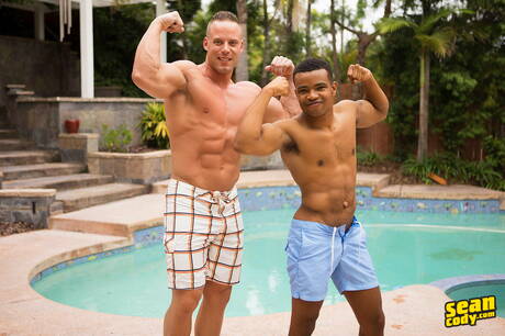 Beefcake Jack and hunky guy Ace in hard interracial anal sex in the pool