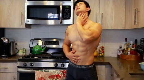 Oriental bull Peter Le teasing his cock in the kitchen