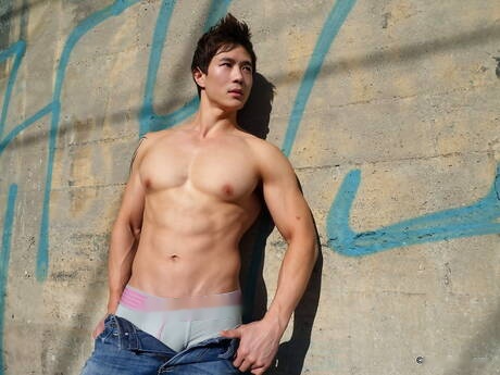 Oriental muscular Peter Le shows a sturdy body outdoor
