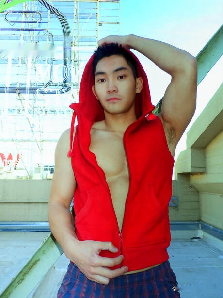 Asian muscular Eric East shows a perfect body outdoor