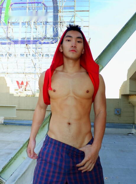 Asian muscular Eric East shows a perfect body outdoor