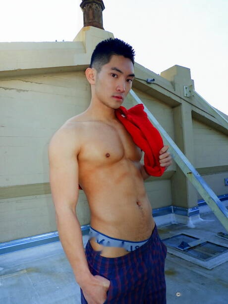 Asian muscular Eric East shows a perfect body outdoor