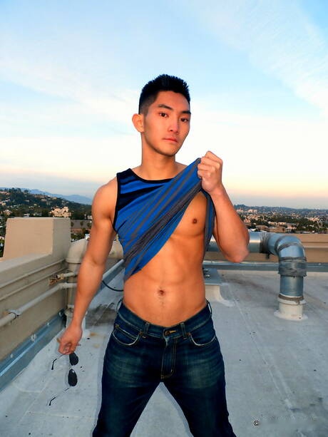 Asian strong bull Eric East posing naked outdoor