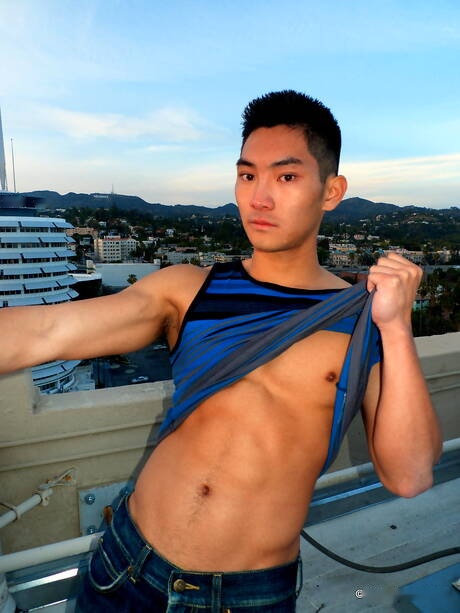 Asian strong bull Eric East posing naked outdoor