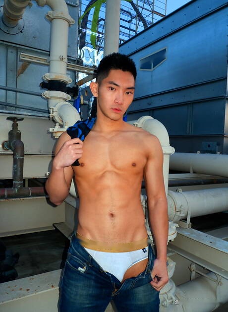 Asian strong bull Eric East posing naked outdoor