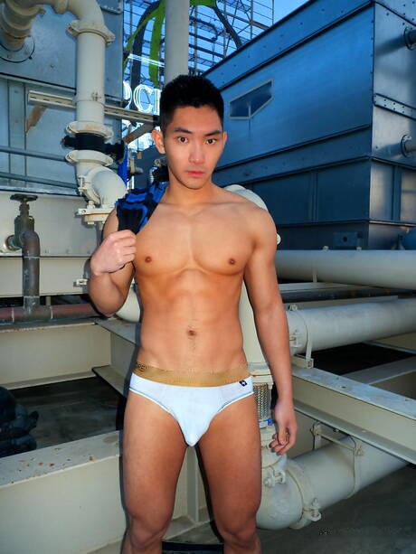 Asian strong bull Eric East posing naked outdoor