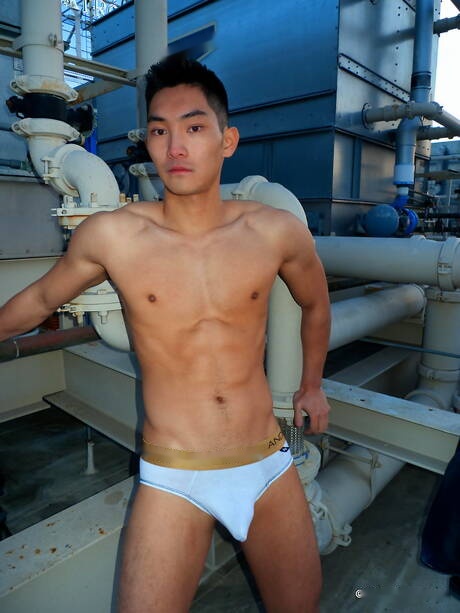 Asian strong bull Eric East posing naked outdoor