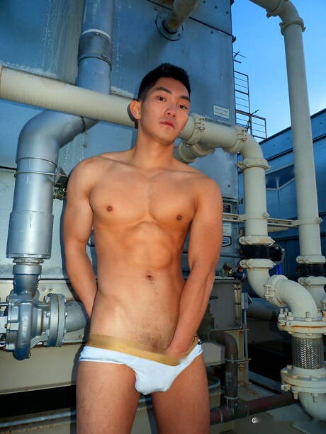 Asian strong bull Eric East posing naked outdoor