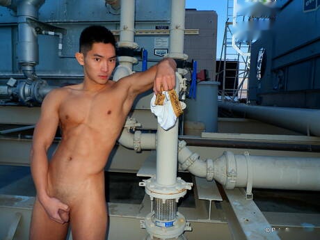 Asian strong bull Eric East posing naked outdoor