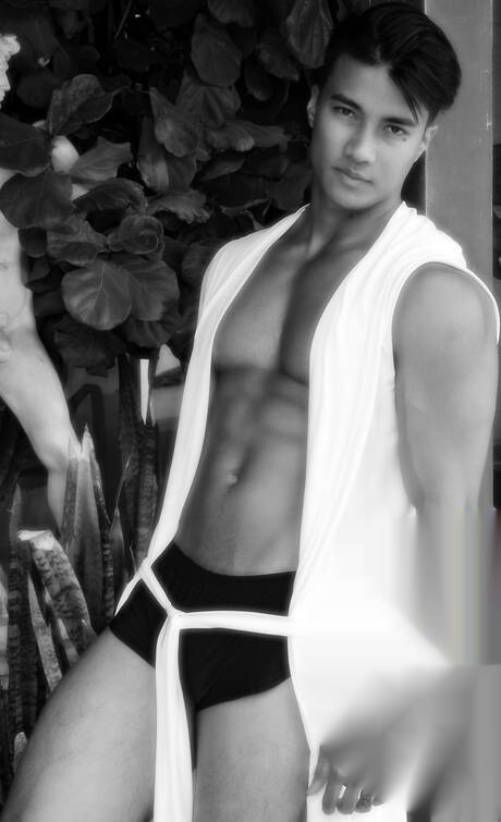 Oriental bodybuilder Ken Ott shows a sturdy body at pool