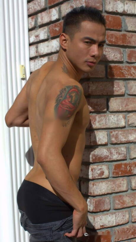 Oriental tough guy Jethro undressing and showing his ass outdoor
