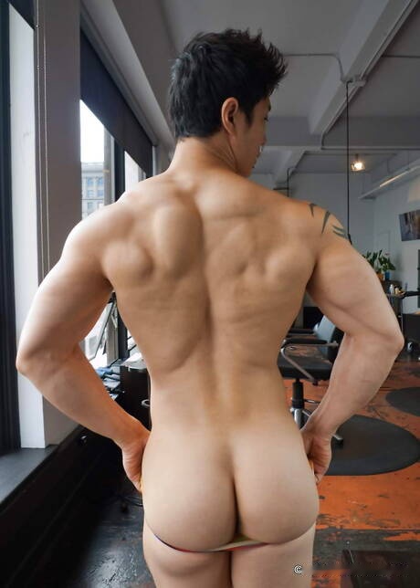 Asian tattooed bodybuilder Peter Le posing naked and showing his bubble butt
