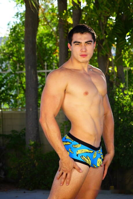 Oriental strong bull Axel Kane undressing and showing hot ass at the pool