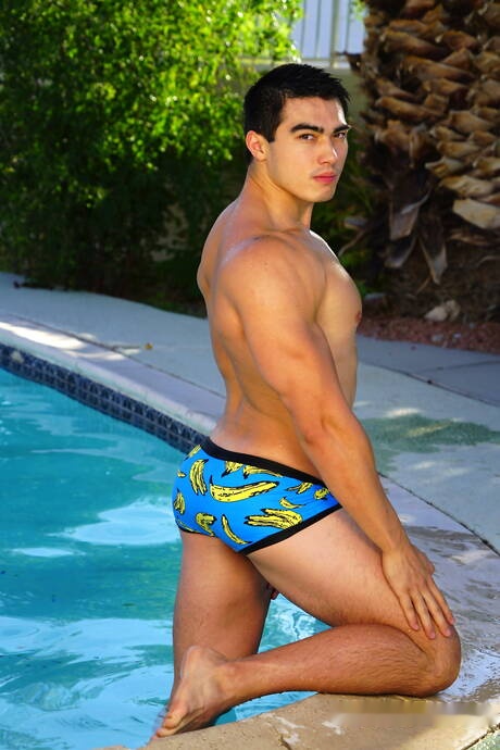 Oriental strong bull Axel Kane undressing and showing hot ass at the pool