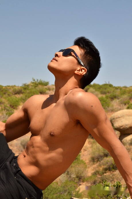 Asian bodybuilder Ken Ott posing nude outdoor