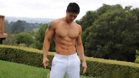 Oriental bull Peter Le undressing and showing tight butt outdoor